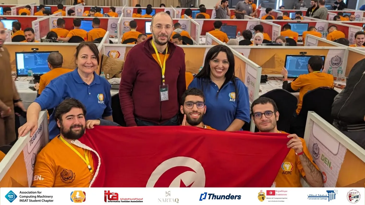 Team holding the Tunisian flag at ACPC 2025